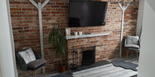 Creating a Cozy Fireplace with XVIII Century Reclaimed Brick Slips: A Customer's Project Completed with Our Authentic Materials