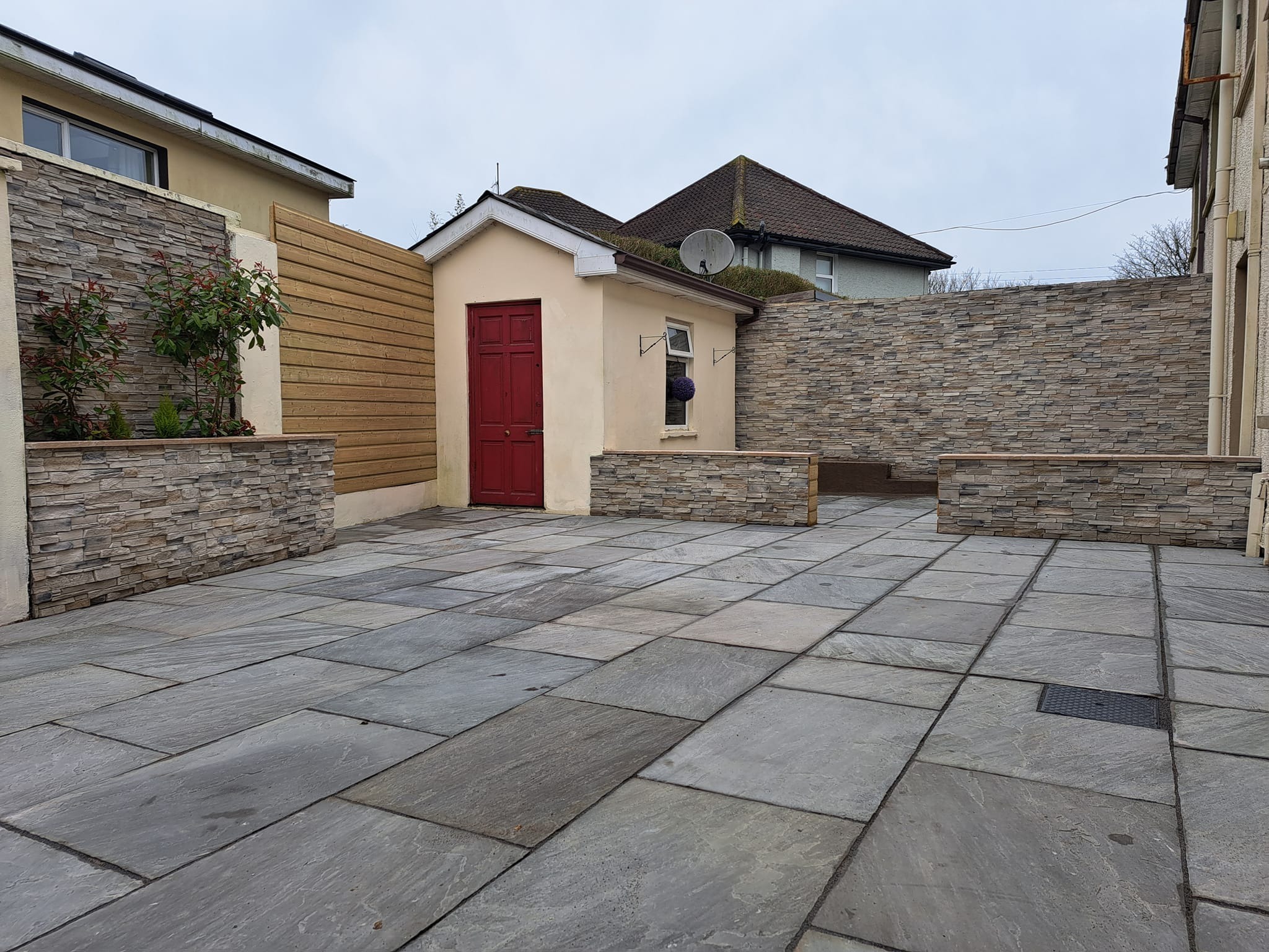 Revamping a Residential Exterior with Stone Grenada Frost: A Stunning Project Completed by our Business Partner